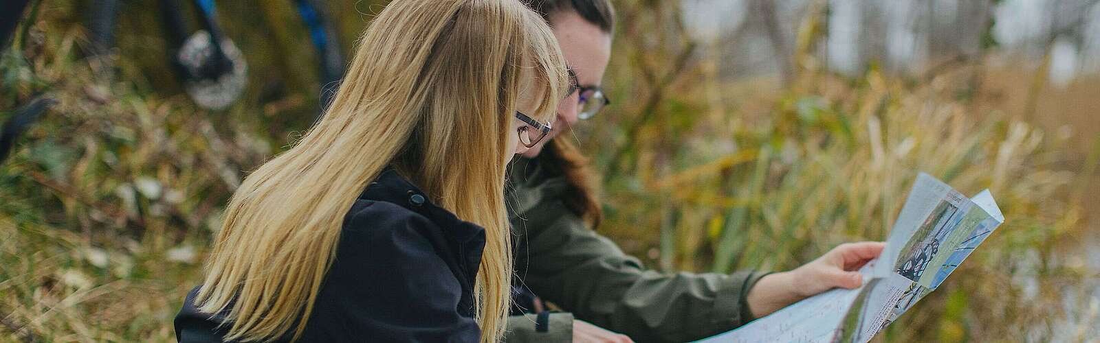 Female cyclist with map